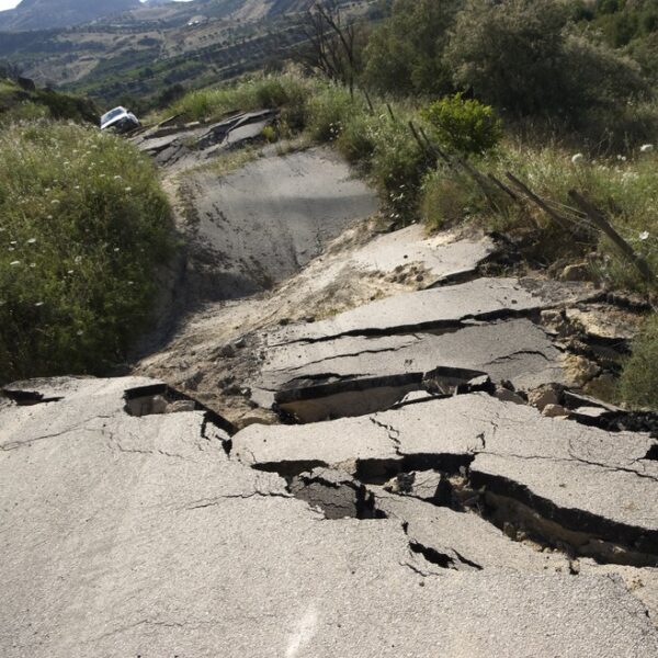 road crumbled by an earthquake - deposit photos
