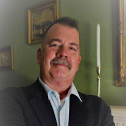 Mark E. Drotos